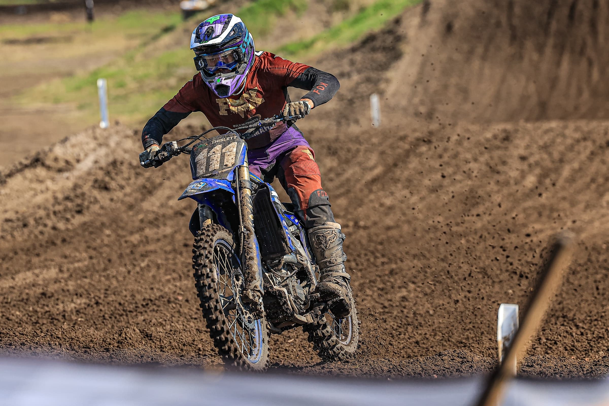 Judd Chislett hard on the throttle out of a berm