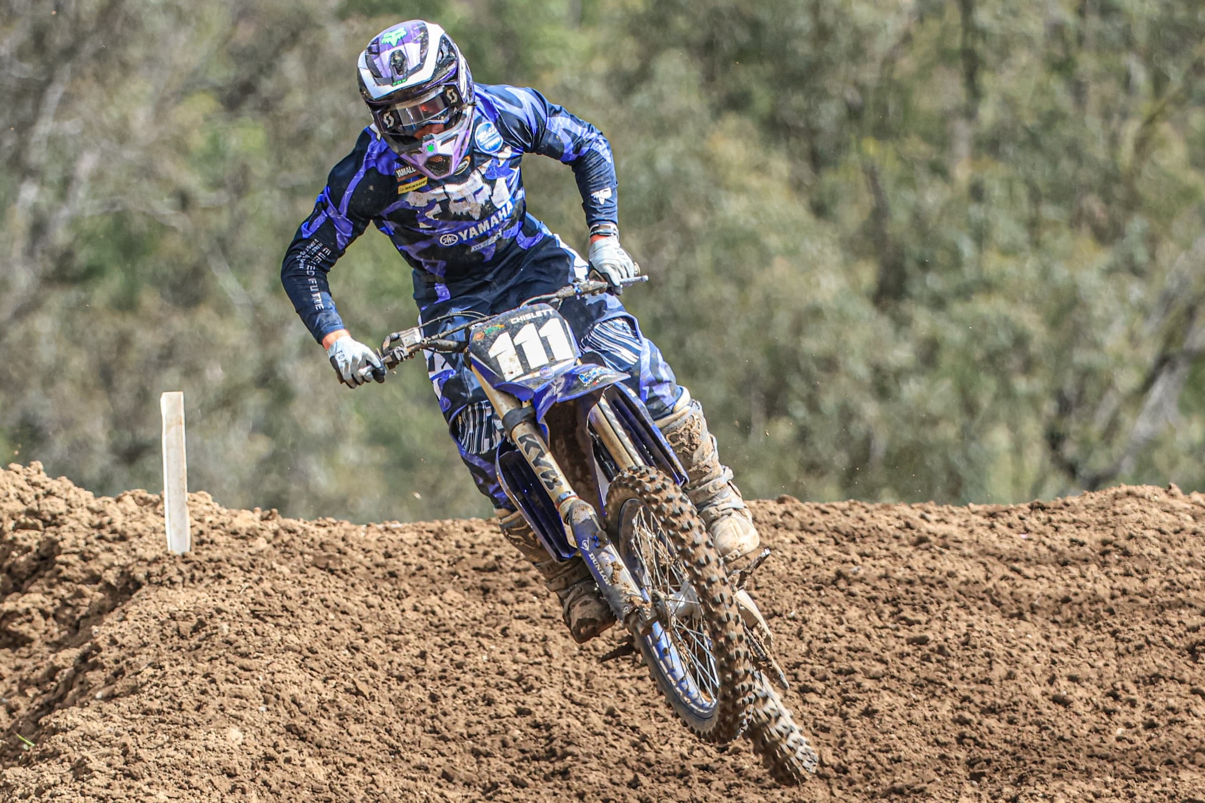 Judd Chislett cresting a hill through the gum trees
